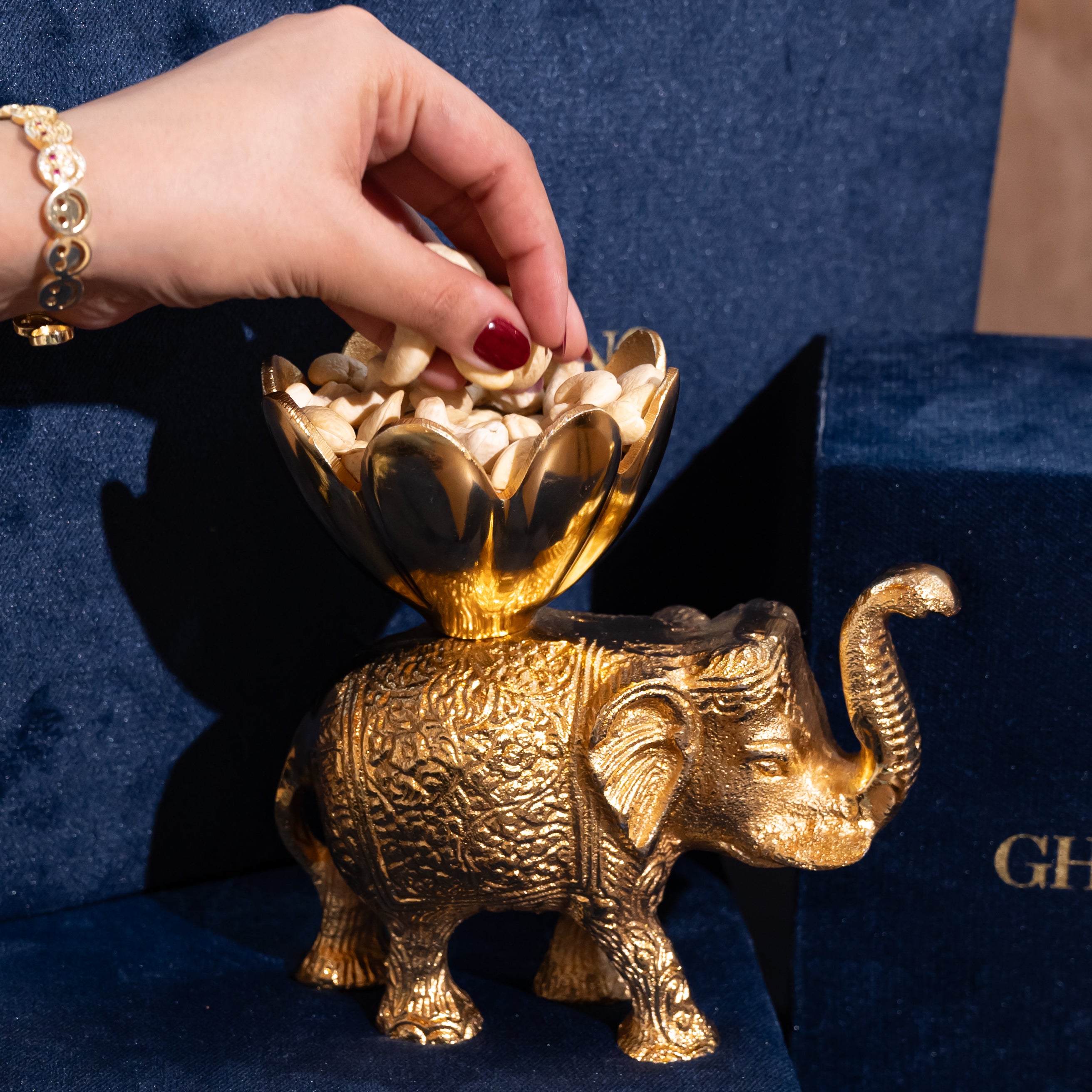 Gold-Plated Elephant with a Flower-Shaped Bowl on Its Back