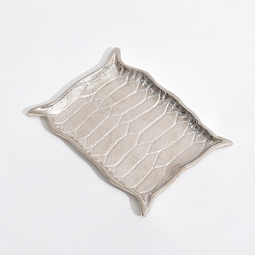 Silver Platter shaped like Alladin's Magic Carpet with a Ferrero Rocher and a book