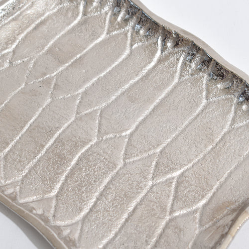 Silver Platter shaped like Alladin's Magic Carpet with a Ferrero Rocher and a book